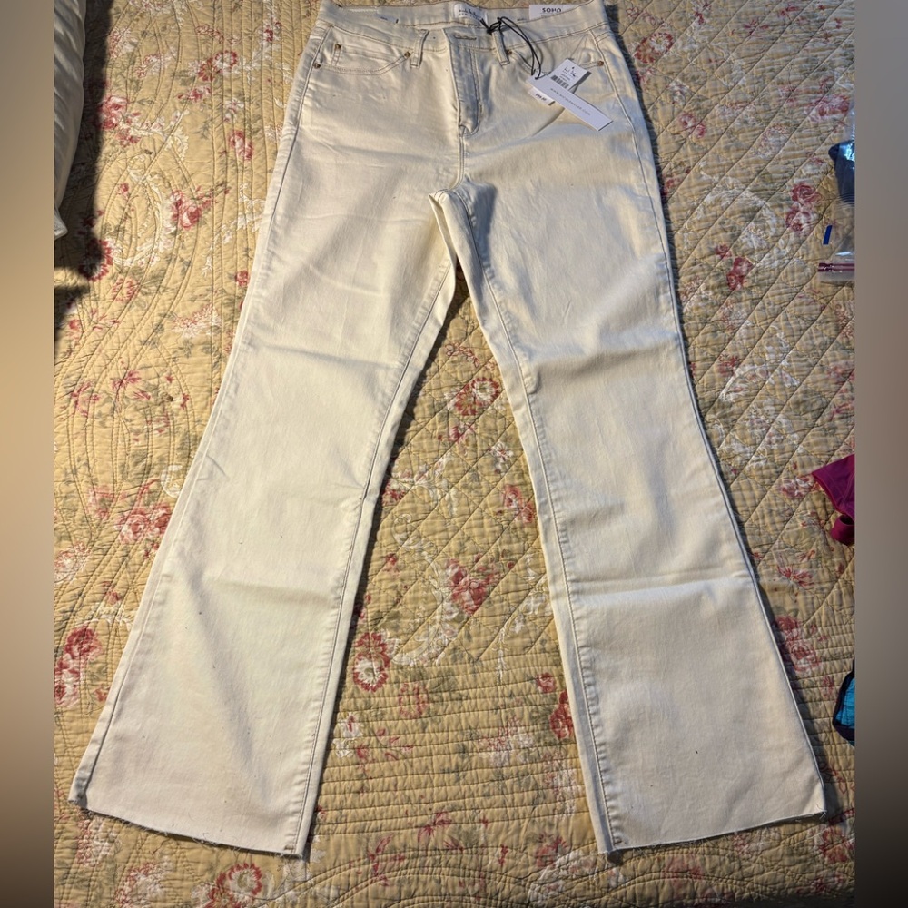 Brand new women’s cream colored jeans.